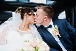 Couple Kissing in Wedding Limo in Las Vegas